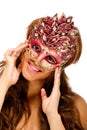 Pretty young happy female with masqurade mask