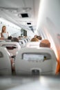 Pretty, young happy woman aboard an airplane