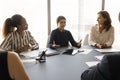 Pretty young Indian business leader woman talking to partners Royalty Free Stock Photo