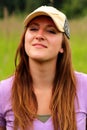 Pretty young lady wearing ball cap Royalty Free Stock Photo