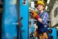 Young Machine Operator Concentrated on Work