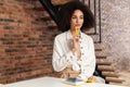 Pretty young African American woman making notes Royalty Free Stock Photo