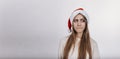 Pretty young model with blonde hair and in Santa hat Royalty Free Stock Photo