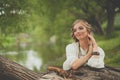 Pretty young model woman in boho style dress at the lake outdoor Royalty Free Stock Photo