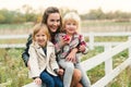 Pretty young mother having fun together with her daughters. Happy loving family. Stylish lovely mother with kids. Family enjoing