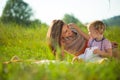 Pretty young mother reading book to her little daughter Royalty Free Stock Photo