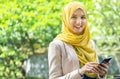 Pretty young muslim woman having a conversation on the phone. Royalty Free Stock Photo