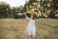 Pretty young native american woman with flying colorful kite having fun outdoors. Royalty Free Stock Photo