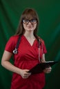 Pretty young nurse wear uniform holding stethoscope clipboard with documents isolated Royalty Free Stock Photo