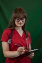 Pretty young nurse wear uniform holding stethoscope clipboard with documents isolated Royalty Free Stock Photo