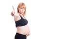 Pretty young pregnant woman showing number one with index finger Royalty Free Stock Photo