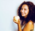 pretty young real tenage girl eating apple close up smiling, wom