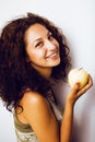 Pretty young real tenage girl eating apple close up smiling