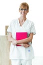 Pretty young receptionist looking at camera and smiling in the reception of clinic. Royalty Free Stock Photo