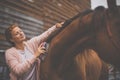 Pretty, young, redhead woman with her lovely horse