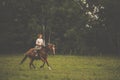 Pretty, young, redhead woman with her lovely horse