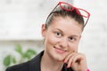 Pretty young secretary with red glasses Royalty Free Stock Photo