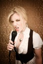 Pretty young singer or comedian with microphone Royalty Free Stock Photo