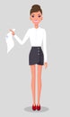 Pretty young slim woman in business clothes. Smiling business woman standing with a paper in hands