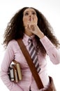 Pretty young student holding books shushing Royalty Free Stock Photo