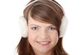 Pretty young teen girl wearing white earmuff Royalty Free Stock Photo