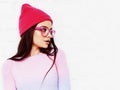 pretty young teenage girl hipster in pink glasses and hat emotio Royalty Free Stock Photo