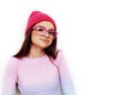 Pretty young teenage girl hipster in pink glasses and hat emotional posing happy smiling, lifestyle people concept Royalty Free Stock Photo