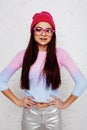 Pretty young teenage girl hipster in pink glasses and hat emotional posing happy smiling, lifestyle people concept Royalty Free Stock Photo