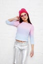 Pretty young teenage girl hipster in pink glasses and hat emotional posing happy smiling, lifestyle people concept Royalty Free Stock Photo