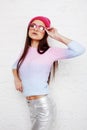 Pretty young teenage girl hipster in pink glasses and hat emotional posing happy smiling, lifestyle people concept Royalty Free Stock Photo