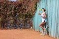 Pretty young female tennis player drinking water eyes closed. Royalty Free Stock Photo