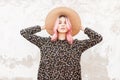 Pretty young woman with amazing pink hair with sexy lips in vintage straw hat in elegant floral black stylish dress posing near Royalty Free Stock Photo