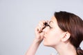 Pretty young woman applying mascara Royalty Free Stock Photo