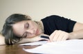 Pretty young woman asleep in the office Royalty Free Stock Photo