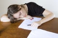 Pretty young woman asleep at the office table Royalty Free Stock Photo