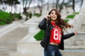 Pretty young woman with beautiful smile talking on mobile phone. Happy girl. Royalty Free Stock Photo