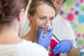 Pretty, young woman being taken care of by medics in a hospital