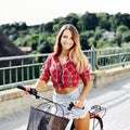 Pretty young woman on a bicycle in summertime Royalty Free Stock Photo