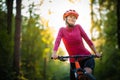 Pretty, young woman biking on a mountain bike