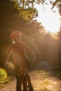 Pretty, young woman biking on a mountain bike Royalty Free Stock Photo