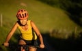 Pretty, young woman biking on a mountain bike Royalty Free Stock Photo