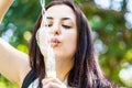 Pretty young woman blowing soap bubbles in the park Royalty Free Stock Photo