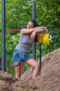 Pretty young woman builder digging a shovel Royalty Free Stock Photo