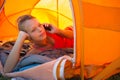 Pretty, young woman camping outdoors Royalty Free Stock Photo