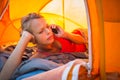 Pretty, young woman camping outdoors Royalty Free Stock Photo