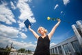 Pretty, young woman celebrating joyfully her graduation Royalty Free Stock Photo