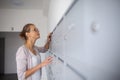 Pretty, young woman checking her mailbox Royalty Free Stock Photo