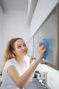 Pretty, young woman in her modern,  bright kitchen Royalty Free Stock Photo