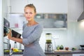 Pretty, young woman in her modern kitchen Royalty Free Stock Photo