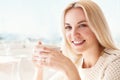 Pretty young woman with cup of coffee in sunny restaraunt Royalty Free Stock Photo